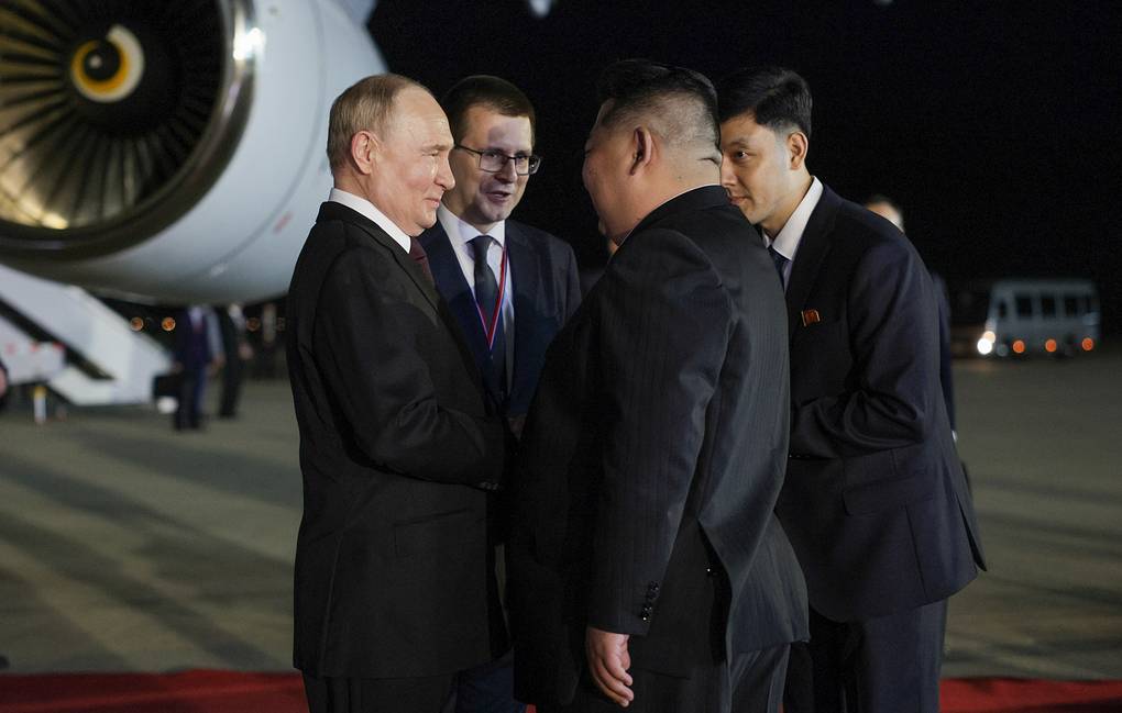 North Korean leader Kim Jong-un welcomes Russia's President Vladimir Putin (R-L front) at the airport. Russian Presidential Press and Information Office/Gavriil Grigorov/TASS